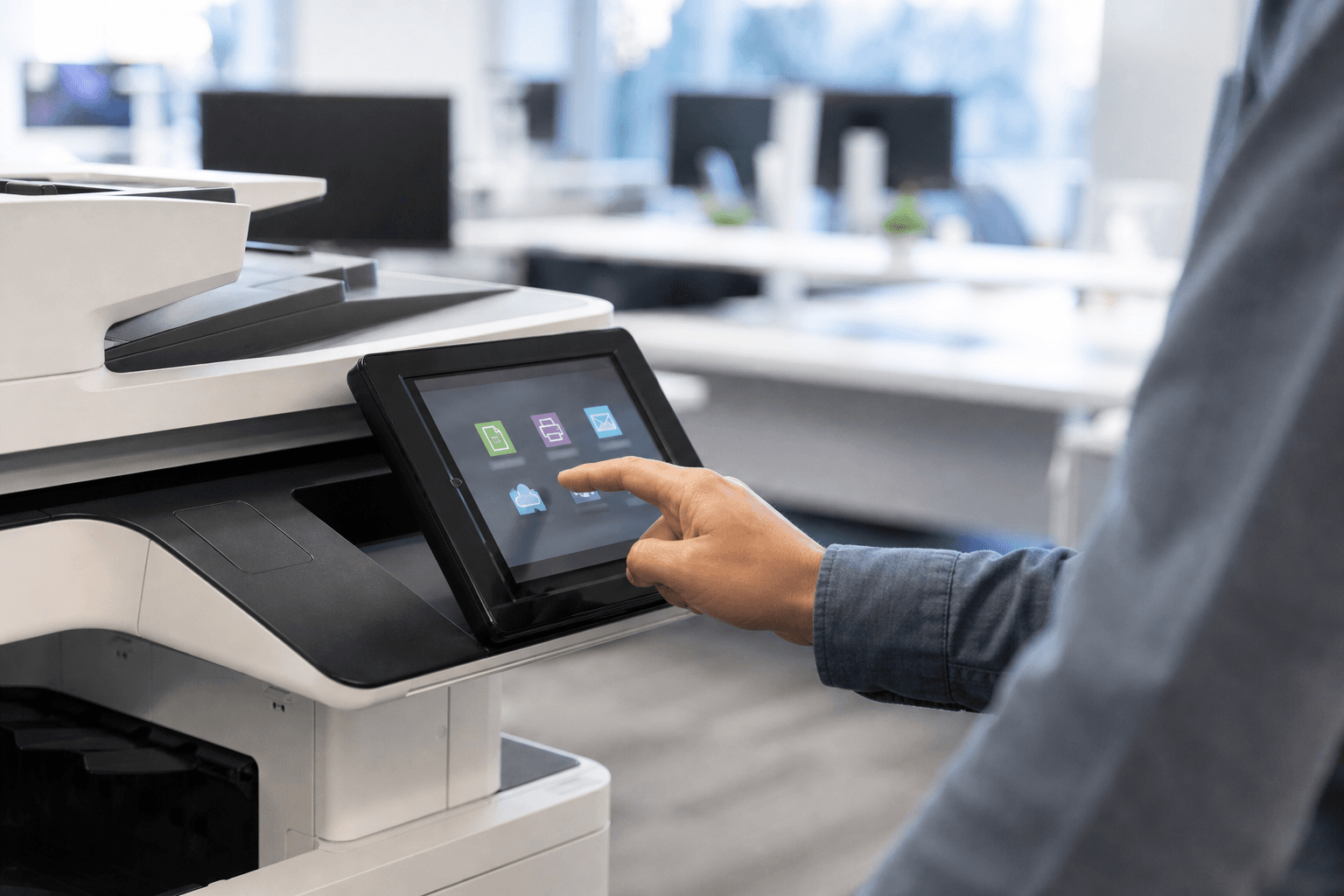 A user is clicking through print, scan, fax options on a firm's big copier machine.